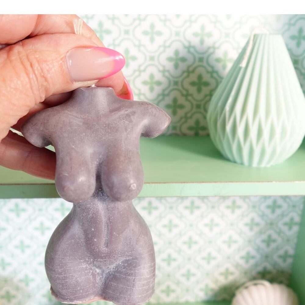 A nude Female torso bust candle in mocha